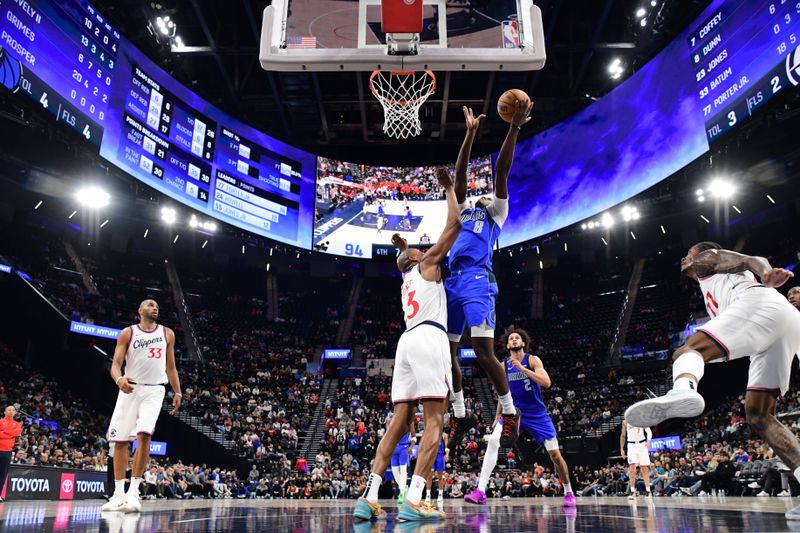 INGLEWOOD, CA - OCTOBER 14: Olivier Maxence-Prosper #8 of the Dallas Mavericks drives to the basket during the game against the LA Clippers during a NBA Preseason game on October 14, 2024 at the Intuit Dome in Inglewood, California. NOTE TO USER: User expressly acknowledges and agrees that, by downloading and/or using this Photograph, user is consenting to the terms and conditions of the Getty Images License Agreement. Mandatory Copyright Notice: Copyright 2024 NBAE (Photo by Adam Pantozzi/NBAE via Getty Images)