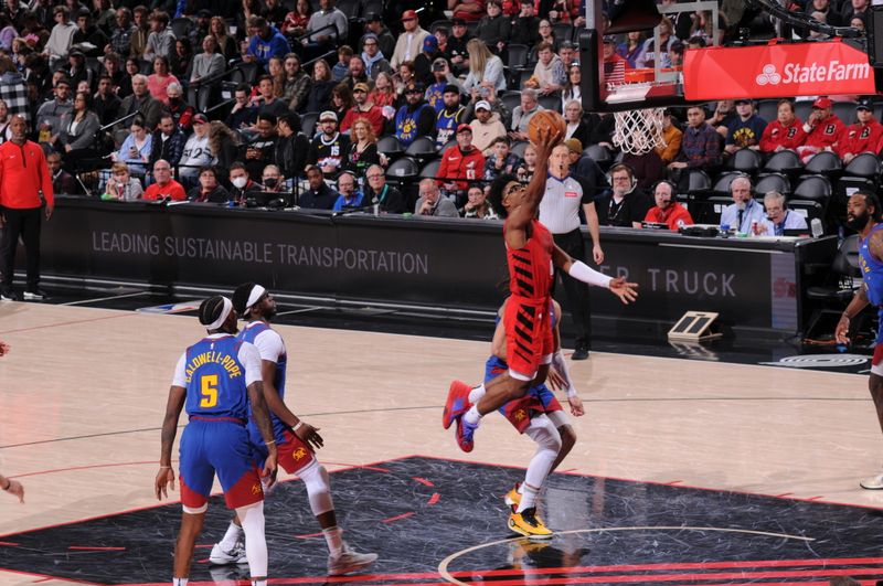 PORTLAND, OR - MARCH 23: Scoot Henderson #00 of the Portland Trail Blazers drives to the basket during the game against the Denver Nuggets on March 23, 2024 at the Moda Center Arena in Portland, Oregon. NOTE TO USER: User expressly acknowledges and agrees that, by downloading and or using this photograph, user is consenting to the terms and conditions of the Getty Images License Agreement. Mandatory Copyright Notice: Copyright 2024 NBAE (Photo by Cameron Browne/NBAE via Getty Images)