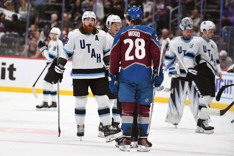 Sep 29, 2024; Denver, Colorado, USA; Utah Hockey Club forward Liam O'Brien (38) talks with Colorado Avalanche left wing Miles Wood (28) after a play during the first period at Ball Arena. Mandatory Credit: Christopher Hanewinckel-Imagn Images