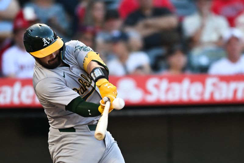 Jul 27, 2024; Anaheim, California, USA; Oakland Athletics catcher Shea Langeliers (23) hits a three-run home run against the Los Angeles Angels during the first inning at Angel Stadium. Mandatory Credit: Jonathan Hui-USA TODAY Sports