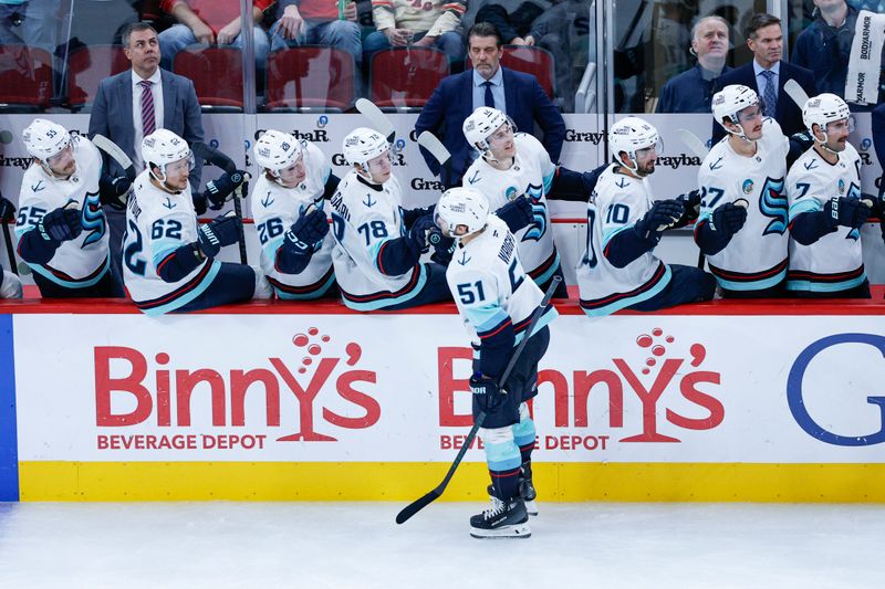 Nov 20, 2025; Chicago, Illinois, USA; Seattle Kraken center Shane Wright (51) celebrates with teammates after scoring against the Chicago Blackhawks during the third period at United Center. Mandatory Credit: Kamil Krzaczynski-Imagn Images