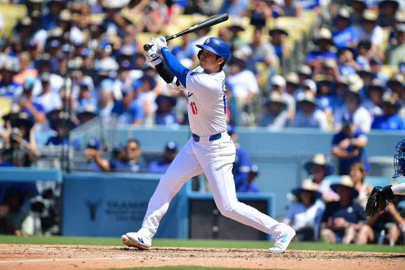 Jun 16, 2024; Los Angeles, California, USA; Los Angeles Dodgers designated hitter Shohei Ohtani (17) hits against the Kansas City Royals during the seventh inning at Dodger Stadium. Mandatory Credit: Gary A. Vasquez-USA TODAY Sports