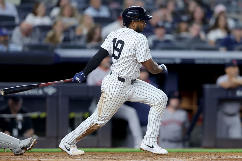 Jun 7, 2025; Bronx, New York, USA; New York Yankees third baseman Pablo Reyes (19) follows through on an RBI ground out during the fourth inning against the Boston Red Sox at Yankee Stadium. Mandatory Credit: Brad Penner-Imagn Images