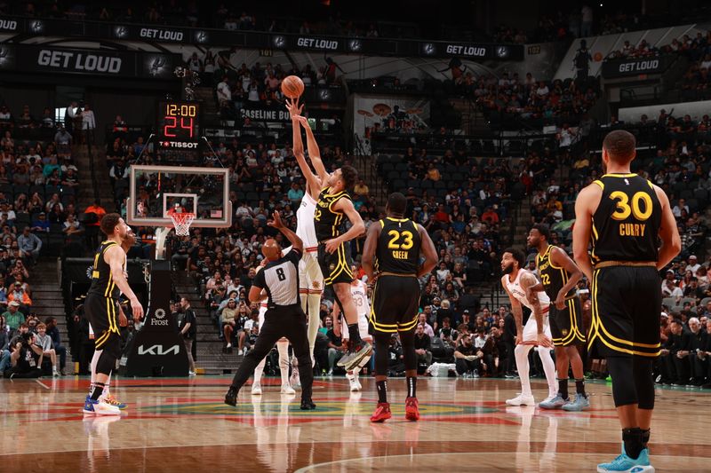 SAN ANTONIO, TX - MARCH 31: Victor Wembanyama #1 of the San Antonio Spurs and Trayce Jackson-Davis #32 of the Golden State Warriors go up for the opening tip off on March 31, 2024 at the Frost Bank Center in San Antonio, Texas. NOTE TO USER: User expressly acknowledges and agrees that, by downloading and or using this photograph, user is consenting to the terms and conditions of the Getty Images License Agreement. Mandatory Copyright Notice: Copyright 2024 NBAE (Photos by Joe Murphy/NBAE via Getty Images)