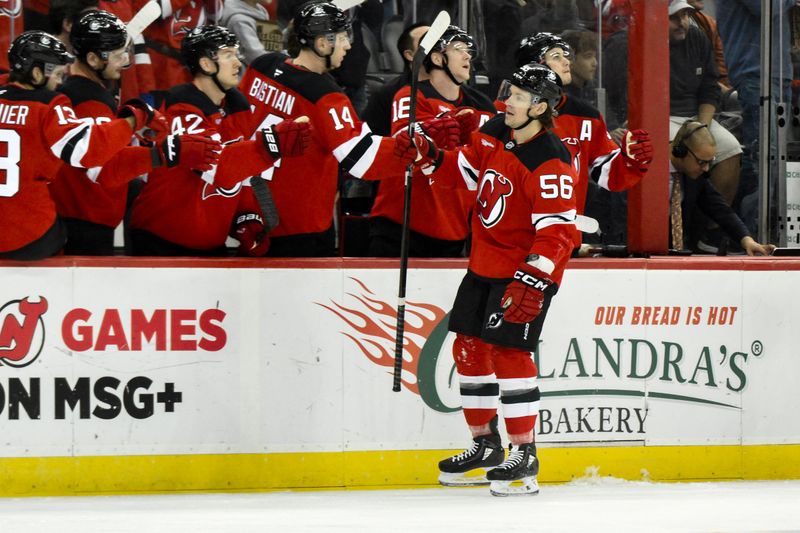 Oct 19, 2024; Newark, New Jersey, USA; New Jersey Devils left wing Erik Haula (56) celebrates with teammates after scoring a goal against the Washington Capitals during the first period at Prudential Center. Mandatory Credit: John Jones-Imagn Images