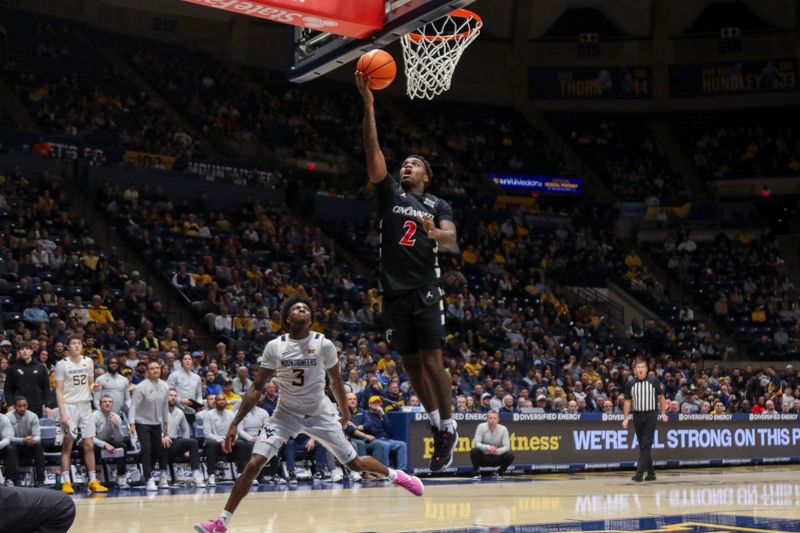 Jan 6, 2026; Morgantown, West Virginia, USA; Cincinnati Bearcats guard Jizzle James (2) shoots in the lane during the first half against the West Virginia Mountaineers at Hope Coliseum. Mandatory Credit: Ben Queen-Imagn Images