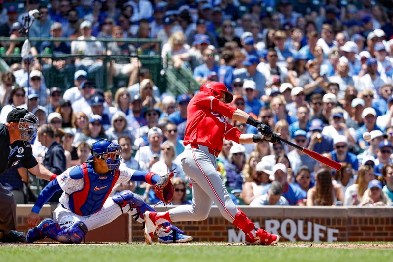 Jun 2, 2024; Chicago, Illinois, USA; 
Cincinnati Reds outfielder TJ Friedl (29) hits a three-run home run against the Chicago Cubs during the second inning at Wrigley Field. Mandatory Credit: Kamil Krzaczynski-USA TODAY Sports