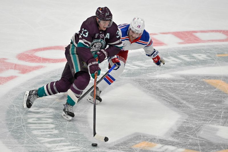 Jan 21, 2024; Anaheim, California, USA; Anaheim Ducks right wing Jakob Silfverberg (33) and New York Rangers left wing Alexis Lafreniere (13) battle for the puck in the first period at Honda Center. Mandatory Credit: Jayne Kamin-Oncea-USA TODAY Sports