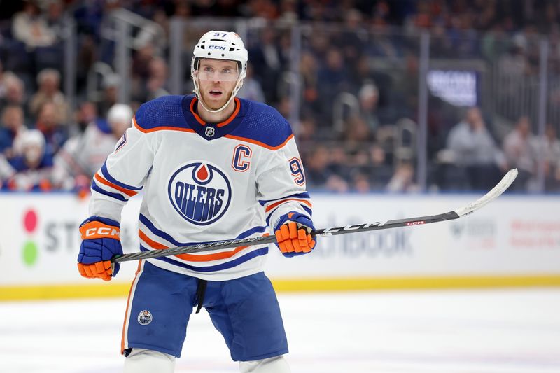 Dec 19, 2023; Elmont, New York, USA; Edmonton Oilers center Connor McDavid (97) skates against the New York Islanders during the first period at UBS Arena. Mandatory Credit: Brad Penner-USA TODAY Sports