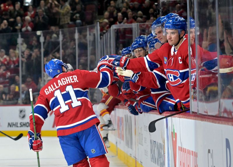 Nov 5, 2024; Montreal, Quebec, CAN; Montreal Canadiens forward Brendan Gallagher (11) celebrates with teammates after scoring a goal against the Calgary Flames during the second period at the Bell Centre. Mandatory Credit: Eric Bolte-Imagn Images