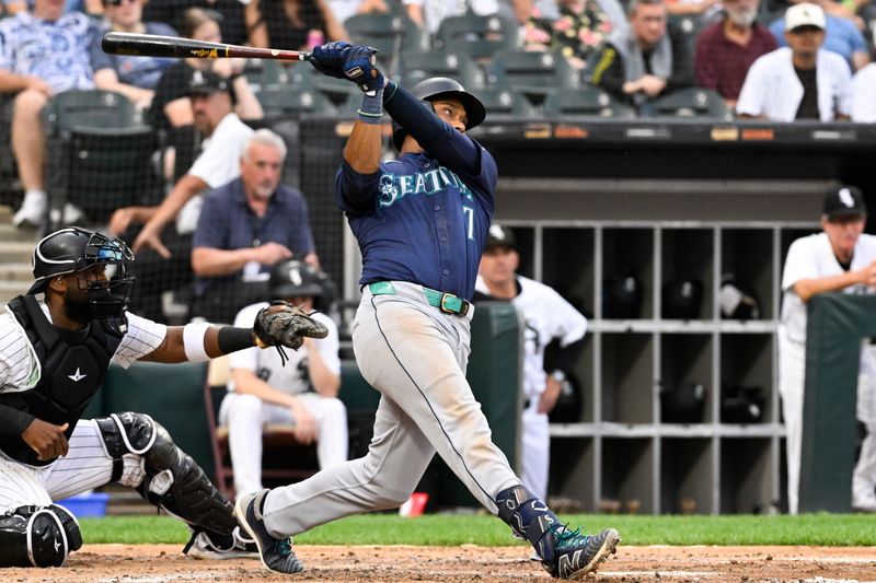 Jul 27, 2024; Chicago, Illinois, USA;  Seattle Mariners second baseman Jorge Polanco (7) hits a home run against the Chicago White Sox during the fourth inning at Guaranteed Rate Field. Mandatory Credit: Matt Marton-USA TODAY Sports