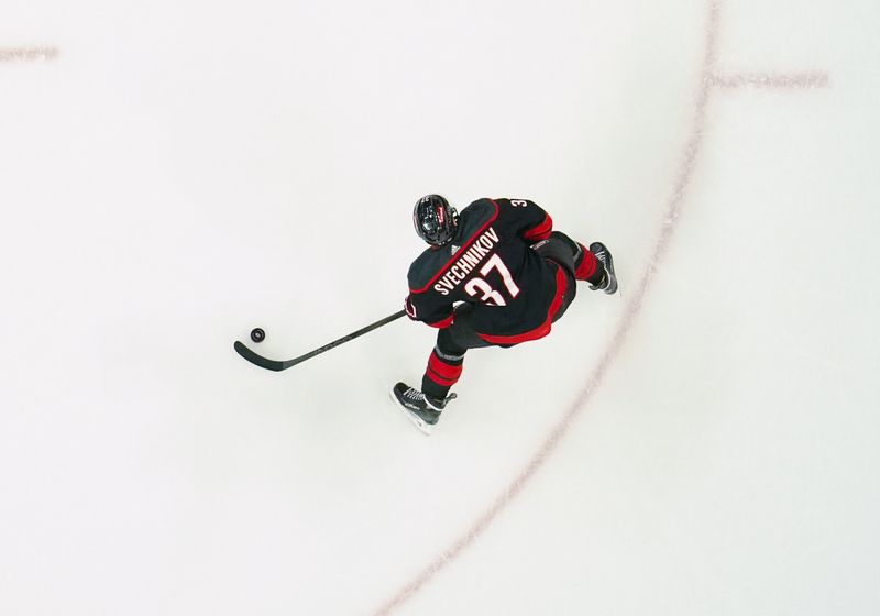 Mar 12, 2024; Raleigh, North Carolina, USA; Carolina Hurricanes right wing Andrei Svechnikov (37) gets ready to take a shot against the New York Rangers during the second period at PNC Arena. Mandatory Credit: James Guillory-USA TODAY Sports