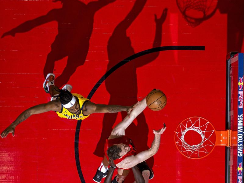 TORONTO, CANADA - FEBRUARY 14: Jakob Poeltl #19 of the Toronto Raptors drives to the basket during the game against the Indiana Pacers on February 14, 2024 at the Scotiabank Arena in Toronto, Ontario, Canada.  NOTE TO USER: User expressly acknowledges and agrees that, by downloading and or using this Photograph, user is consenting to the terms and conditions of the Getty Images License Agreement.  Mandatory Copyright Notice: Copyright 2024 NBAE (Photo by Mark Blinch/NBAE via Getty Images)