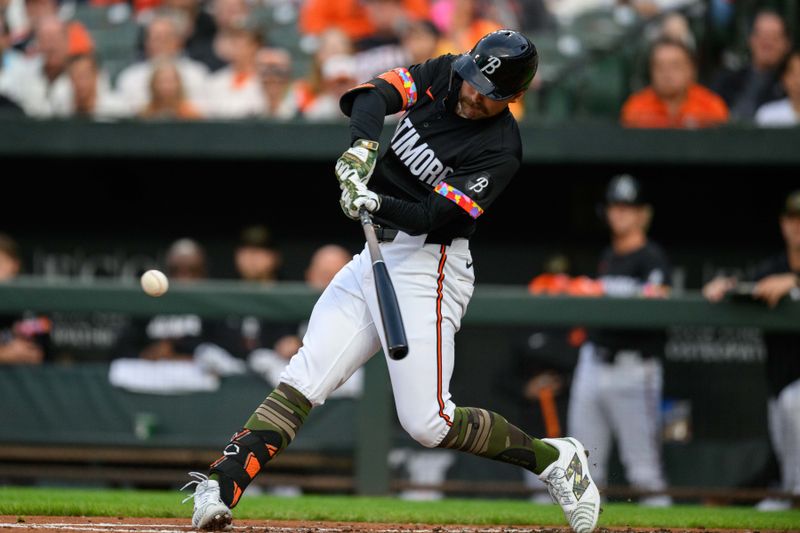 May 17, 2024; Baltimore, Maryland, USA; Baltimore Orioles outfielder Colton Cowser (17) hits a double during the first inning against the Seattle Mariners at Oriole Park at Camden Yards. Mandatory Credit: Reggie Hildred-USA TODAY Sports