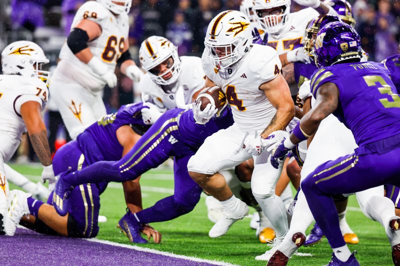 Oct 21, 2023; Seattle, Washington, USA; Arizona State Sun Devils running back Cameron Skattebo (4) rushes for a touchdown against the Washington Huskies during the second quarter at Alaska Airlines Field at Husky Stadium. Mandatory Credit: Joe Nicholson-USA TODAY Sports