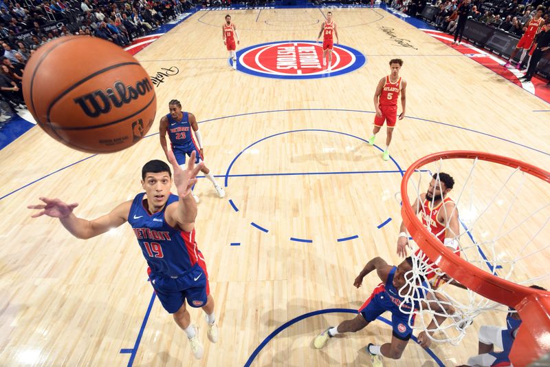 DETROIT, MI - NOVEMBER 8: Simone Fontecchio #19 of the Detroit Pistons goes up for the rebound during the game against the Atlanta Hawks on November  8, 2024 at Little Caesars Arena in Detroit, Michigan. NOTE TO USER: User expressly acknowledges and agrees that, by downloading and/or using this photograph, User is consenting to the terms and conditions of the Getty Images License Agreement. Mandatory Copyright Notice: Copyright 2024 NBAE (Photo by Chris Schwegler/NBAE via Getty Images)