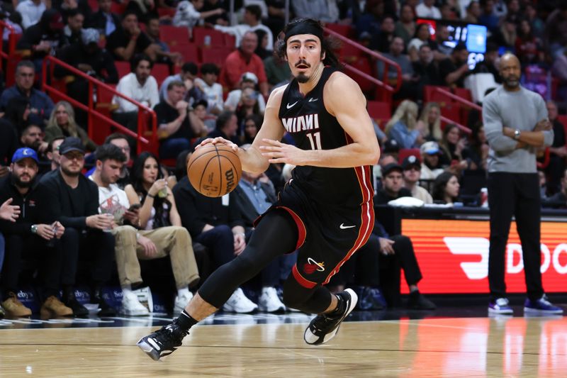 MIAMI, FLORIDA - FEBRUARY 06: Jaime Jaquez Jr. #11 of the Miami Heat dribbles the ball against the Orlando Magic during the third quarter of the game at Kaseya Center on February 06, 2024 in Miami, Florida. NOTE TO USER: User expressly acknowledges and agrees that, by downloading and or using this photograph, User is consenting to the terms and conditions of the Getty Images License Agreement. (Photo by Megan Briggs/Getty Images)