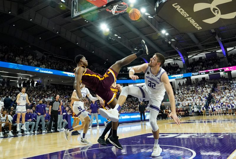 Mar 9, 2024; Evanston, Illinois, USA; Minnesota Golden Gophers forward Pharrel Payne (21) defends Northwestern Wildcats forward Blake Preston (32) during the second half at Welsh-Ryan Arena. Mandatory Credit: David Banks-USA TODAY Sports