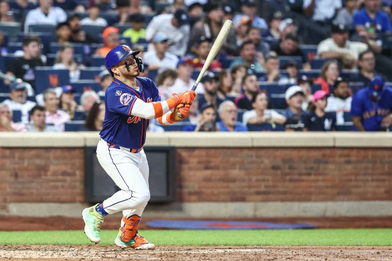 Jun 26, 2024; New York City, New York, USA;  New York Mets catcher Francisco Alvarez (4) hits a two run home run in the third inning against the New York Yankees at Citi Field. Mandatory Credit: Wendell Cruz-USA TODAY Sports