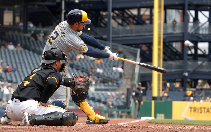 Apr 25, 2024; Pittsburgh, Pennsylvania, USA;  Milwaukee Brewers designated hitter Rhys Hoskins (12) hits an RBI single against the Pittsburgh Pirates during the fifth inning at PNC Park. Mandatory Credit: Charles LeClaire-USA TODAY Sports