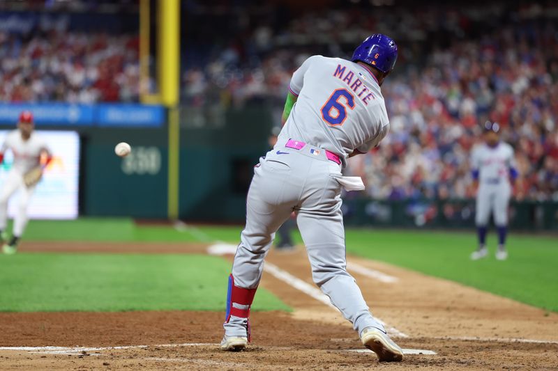 Sep 10, 2025; Philadelphia, Pennsylvania, USA; New York Mets outfielder Starling Marte (6) hits an RBI single against the Philadelphia Phillies during the fourth inning at Citizens Bank Park. Mandatory Credit: Bill Streicher-Imagn Images