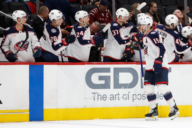 Sep 27, 2024; Washington, District of Columbia, USA; Columbus Blue Jackets center Adam Fantilli (19) celebrates with teammates after scoring a goal against the Washington Capitals in the third period at Capital One Arena. Mandatory Credit: Geoff Burke-Imagn Images