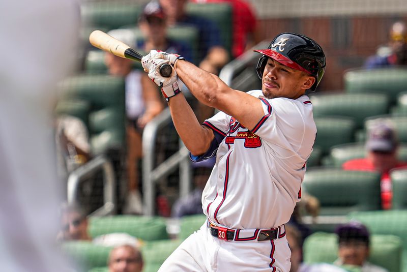 Sep 24, 2025; Cumberland, Georgia, USA; Atlanta Braves catcher Drake Baldwin (30) strikes out while batting against the Washington Nationals during the seventh inning at Truist Park. Mandatory Credit: Dale Zanine-Imagn Images
