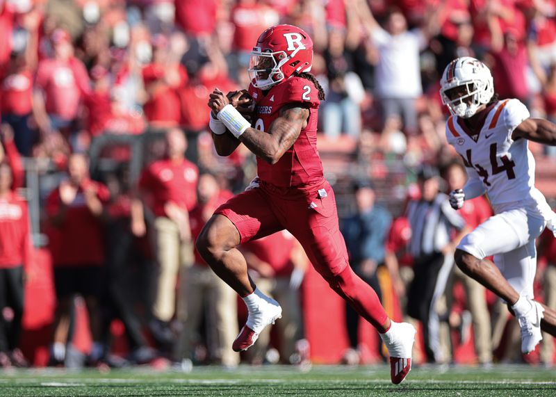 Sep 16, 2023; Piscataway, New Jersey, USA;  Rutgers Scarlet Knights quarterback Gavin Wimsatt (2) scores a rushing touchdown during the first half in front of Virginia Tech Hokies cornerback Dorian Strong (44) at SHI Stadium. Mandatory Credit: Vincent Carchietta-USA TODAY Sports