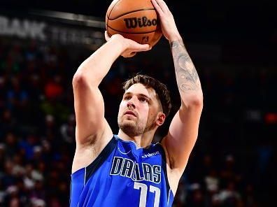 PHOENIX, AZ - DECEMBER 25: Luka Doncic #77 of the Dallas Mavericks shoots a free throw during the game against the Phoenix Suns on December 25, 2023 at Footprint Center in Phoenix, Arizona. NOTE TO USER: User expressly acknowledges and agrees that, by downloading and or using this photograph, user is consenting to the terms and conditions of the Getty Images License Agreement. Mandatory Copyright Notice: Copyright 2023 NBAE (Photo by Barry Gossage/NBAE via Getty Images)