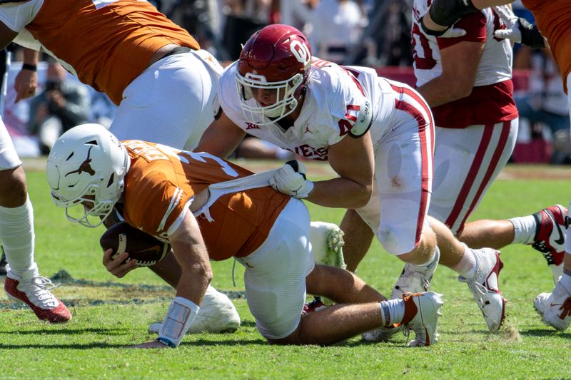 Oct 7, 2023; Dallas, Texas, USA; Texas Longhorns quarterback Quinn Ewers (3) is sacked by Oklahoma Sooners defensive lineman Ethan Downs (40) during the second half at the Cotton Bowl. Mandatory Credit: Jerome Miron-USA TODAY Sports