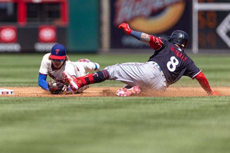 Aug 13, 2023; Philadelphia, Pennsylvania, USA; Minnesota Twins catcher Christian Vazquez (8) is tug out by Philadelphia Phillies second baseman Bryson Stott (5) after attempting to advance to second after hitting a single during the second inning at Citizens Bank Park. Mandatory Credit: Bill Streicher-USA TODAY Sports