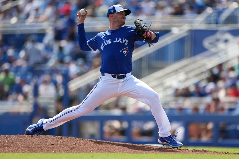 Feb 28, 2024; Dunedin, Florida, USA;  Toronto Blue Jays relief pitcher Trevor Richards (33) throws a pitch against the Tampa Bay Rays in the fifth inning at TD Ballpark. Mandatory Credit: Nathan Ray Seebeck-USA TODAY Sports