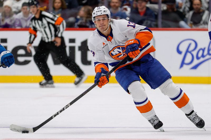 Oct 14, 2024; Denver, Colorado, USA; New York Islanders center Mathew Barzal (13) controls the puck in the first period against the Colorado Avalanche at Ball Arena. Mandatory Credit: Isaiah J. Downing-Imagn Images