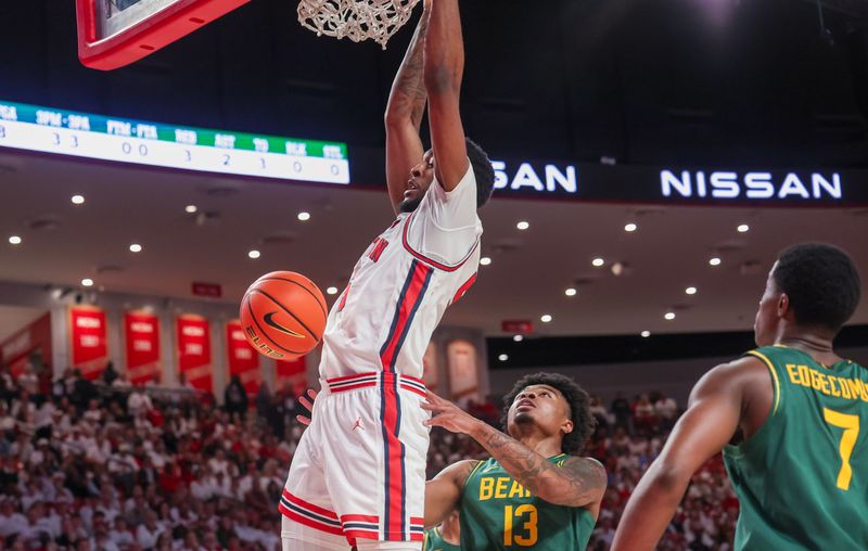 Feb 10, 2025; Houston, Texas, USA; Houston Cougars forward Ja'Vier Francis (5) dunks against Baylor Bears guard Langston Love (13) in the first half at Fertitta Center. Mandatory Credit: Thomas Shea-Imagn Images