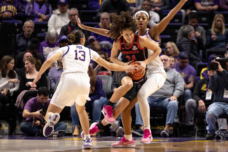 Feb 2, 2023; Baton Rouge, Louisiana, USA;  Georgia Lady Bulldogs forward Brittney Smith (24) drives to the basket against LSU Lady Tigers forward Angel Reese (10) during the first half at Pete Maravich Assembly Center. Mandatory Credit: Stephen Lew-USA TODAY Sports