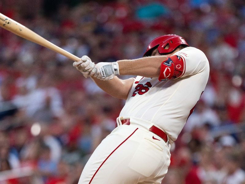 Sep 30, 2023; St. Louis, Missouri, USA; St. Louis Cardinals first baseman Luken Baker (26) hits a RBI double in the first inning at Busch Stadium. Mandatory Credit: Zach Dalin-USA TODAY Sports