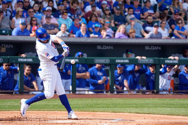 Feb 25, 2024; Mesa, Arizona, USA; Chicago Cubs infielder Dansby Swanson (7) at bat in the fourth inning during a spring training game at Sloan Park against the San Diego Padres. Mandatory Credit: Allan Henry-USA TODAY Sports