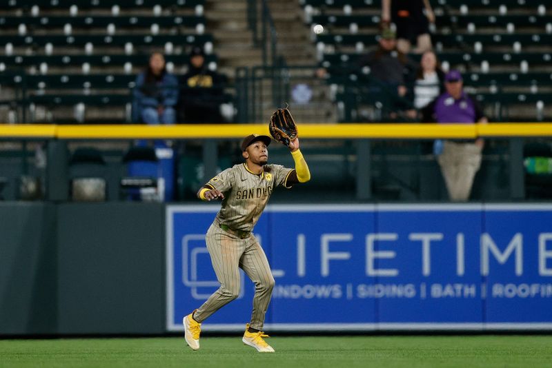 Apr 22, 2024; Denver, Colorado, USA; San Diego Padres left fielder Jose Azocar (28) makes a catch for an out in the ninth inning against the Colorado Rockies at Coors Field. Mandatory Credit: Isaiah J. Downing-USA TODAY Sports