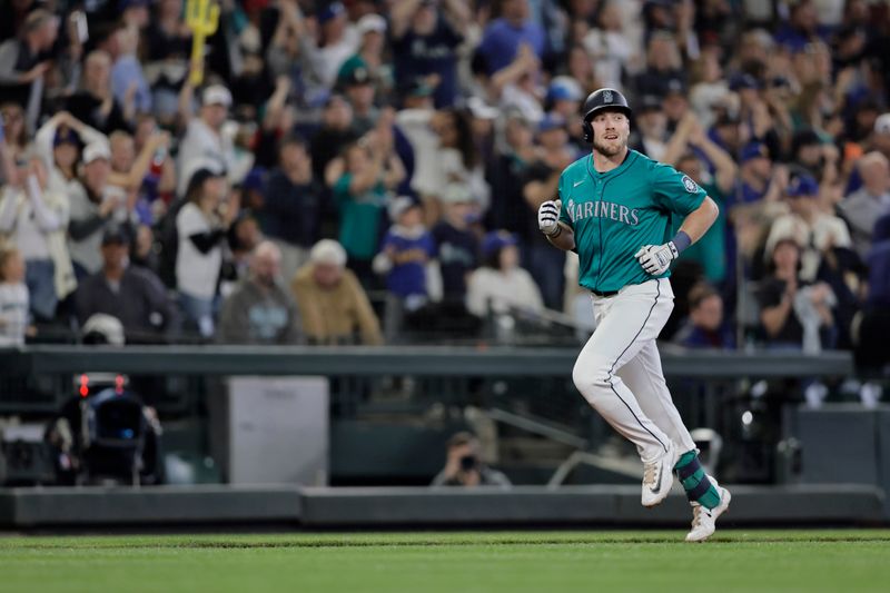 Jun 1, 2024; Seattle, Washington, USA;  Seattle Mariners left fielderer Luke Raley (20) jogs the bases on his solo home run against the Los Angeles Angels during the sixth inning at T-Mobile Park. Mandatory Credit: John Froschauer-USA TODAY Sports