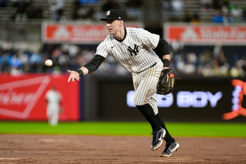 Sep 29, 2024; Bronx, New York, USA; New York Yankees first baseman Ben Rice (93) makes an errand toss to first base after fielding a ground ball against the Pittsburgh Pirates during the sixth inning at Yankee Stadium. Mandatory Credit: John Jones-Imagn Images