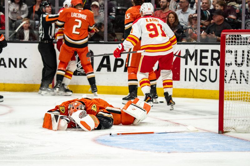 Mar 1, 2026; Anaheim, California, USA; Anaheim Ducks goaltender Lukas Dostal (1) lays on the ice after a hard hit during the first period in the match against the Calgary Flames at Honda Center. Mandatory Credit: Corinne Votaw-Imagn Images