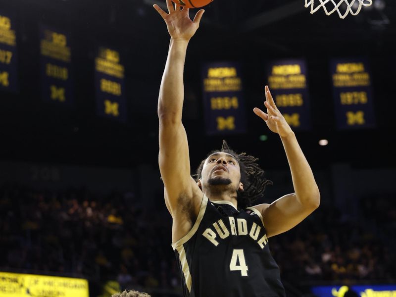 Feb 25, 2024; Ann Arbor, Michigan, USA;  Purdue Boilermakers forward Trey Kaufman-Renn (4) shoots on Michigan Wolverines forward Tray Jackson (2) in the second half at Crisler Center. Mandatory Credit: Rick Osentoski-USA TODAY Sports