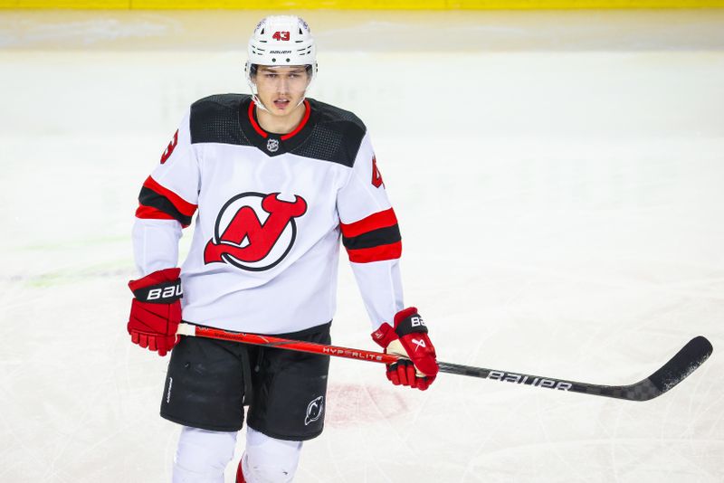 Dec 9, 2023; Calgary, Alberta, CAN; New Jersey Devils defenseman Luke Hughes (43) skates during the warmup period against the Calgary Flames at Scotiabank Saddledome. Mandatory Credit: Sergei Belski-USA TODAY Sports