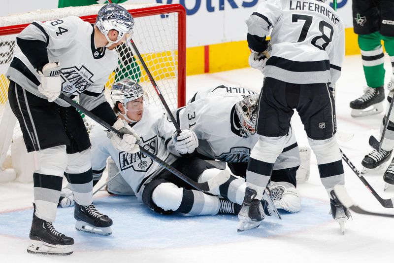 Mar 16, 2024; Dallas, Texas, USA; Los Angeles Kings goaltender David Rittich (31) covers a puck with fallen teammates all around during the third period against the Dallas Stars at American Airlines Center. Mandatory Credit: Andrew Dieb-USA TODAY Sports