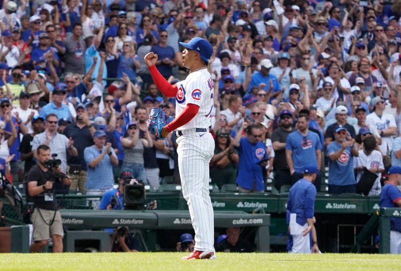 Aug 19, 2023; Chicago, Illinois, USA; Chicago Cubs relief pitcher Adbert Alzolay (73) reacts after getting the final out against the Kansas City Royals during the ninth inning at Wrigley Field. Mandatory Credit: David Banks-USA TODAY Sports