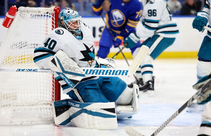 Mar 4, 2025; Buffalo, New York, USA;  San Jose Sharks goaltender Alexandar Georgiev (40) makes a save during the second period against the Buffalo Sabres at KeyBank Center. Mandatory Credit: Timothy T. Ludwig-Imagn Images