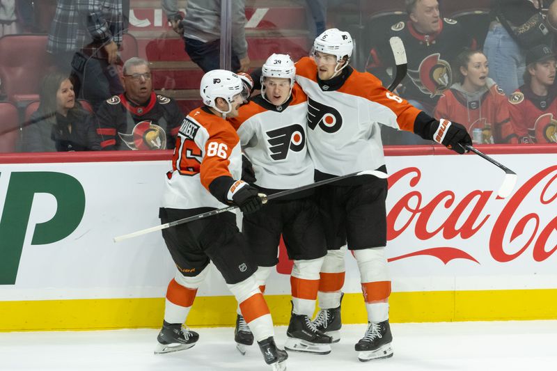 Nov 14, 2024; Ottawa, Ontario, CAN; Philadelphia Flyers right wing Matvei Michkov (39) celebrates withleft wing Joel Farabee (86) and defenseman Travis Sanheim (6) his goal scored in overtime against the Ottawa Senators at the Canadian Tire Centre. Mandatory Credit: Marc DesRosiers-Imagn Images