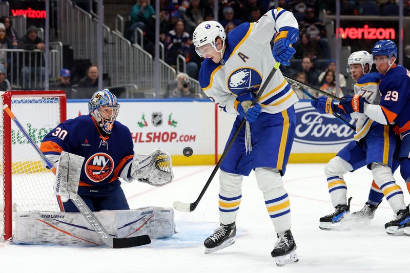 Nov 30, 2024; Elmont, New York, USA; Buffalo Sabres center Tage Thompson (72) attempts to redirect a puck past New York Islanders goaltender Ilya Sorokin (30) during the third period at UBS Arena. Mandatory Credit: Brad Penner-Imagn Images