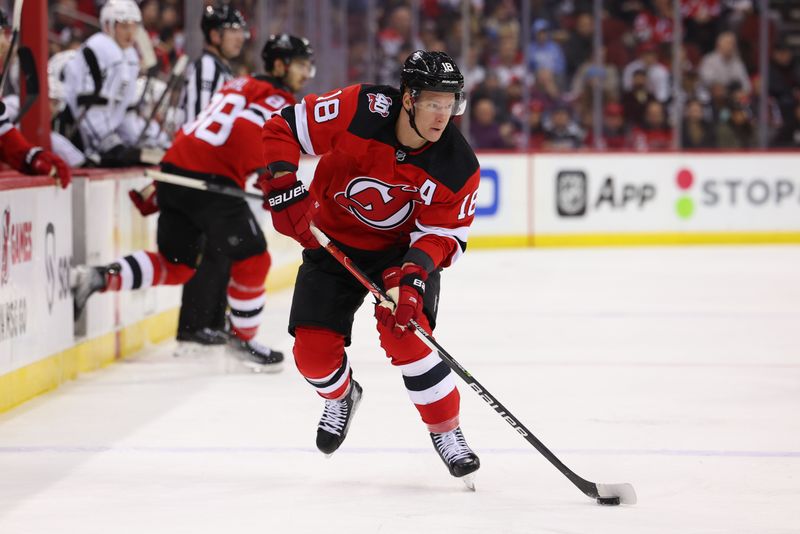 Feb 23, 2023; Newark, New Jersey, USA; New Jersey Devils left wing Ondrej Palat (18) skates with the puck against the Los Angeles Kings during the second period at Prudential Center. Mandatory Credit: Ed Mulholland-USA TODAY Sports