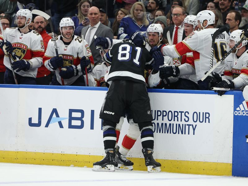 Feb 17, 2024; Tampa, Florida, USA;  Tampa Bay Lightning defenseman Erik Creak (81) and Florida Panthers center Carter Verhaeghe (23) fight in the second period at Amalie Arena. Mandatory Credit: Nathan Ray Seebeck-USA TODAY Sports